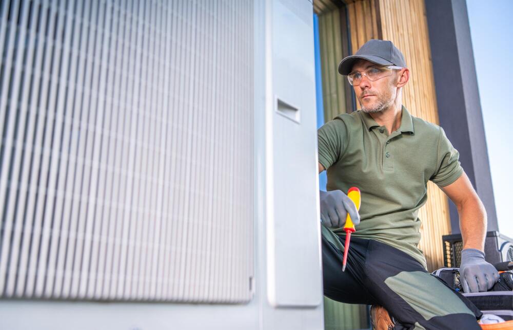 Professional Patriot HVAC expert performing maintenance on an exterior AC condenser unit